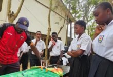 • Marshall Nortey, Head of Technical, Rugby League, demonstrates to school children some techniques of the game