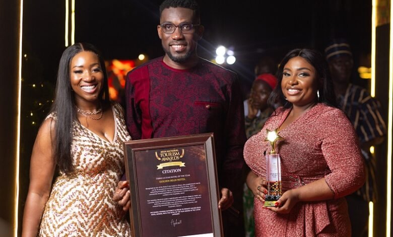 • Mr Clottey and his team displaying the award