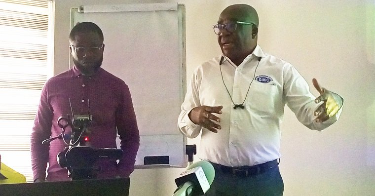 • Mr Mensah (right) briefing the JBA group on the GMCs operations