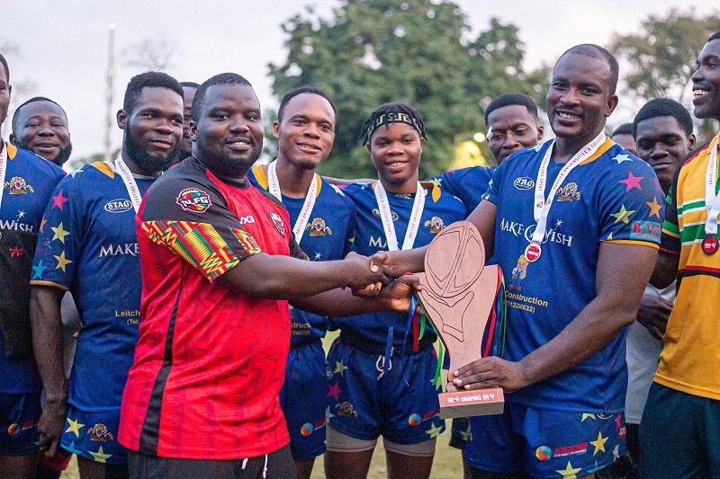 • Mr. Mustapha (left) present the championship trophy to captain of Nungua Tigers Oliver Puman