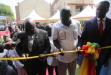 President Akufo-Addo (left), being supported by Dr. Yaw Osei Adutwum (right), and Nii Kwartei Titus Glover (second from right), to inaugurate the St. Barnabas School