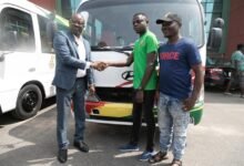 • President Simeon-Okraku presenting in a hand shake with Habib Mohammed, director of operations at Victory Club Warriors FC