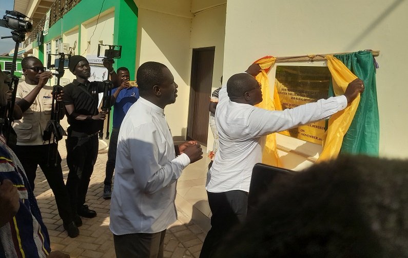 • Martin Adjei Mensah-Korsah (inset) uveiling the plaque of the transport terminal