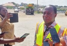 • Inset: Dr Amoh explaining issues to journalists during the inspection of work on the road