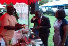 • Mr Addo (second right) sampling one of the grilled broilers