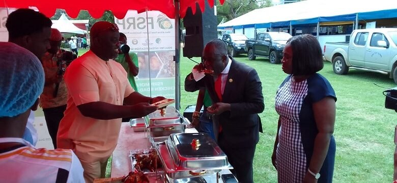 • Mr Addo (second right) sampling one of the grilled broilers