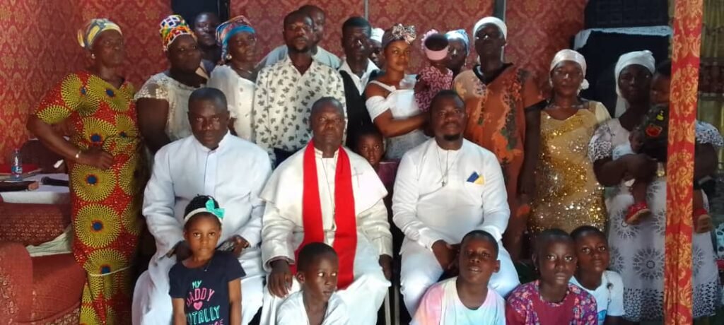 • Rev. Koranteng (middle) with some of the church members