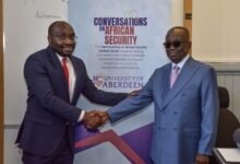 • Dr Lekunze (left) in a handshake with Mr Kan-Dapaah (right)