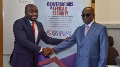 Dr Lekunze (left) in a handshake with Mr Kan-Dapaah (right)