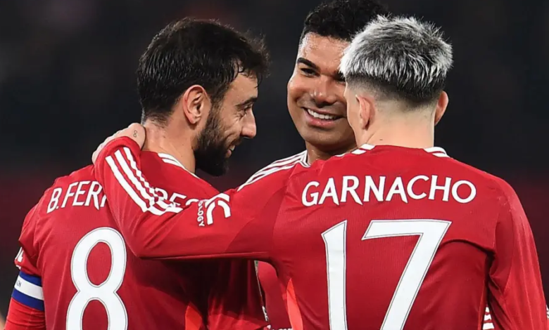 • Manchester United players celebrating their victory over Leicester