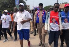 Mr Darko-Mensah ( second rt) flanked by Mr Joe Ghartey (left) and Dr Matthew Opoku Prempeh on campaign walk in Takoradi