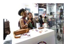 People pose for photos at the booth of South Africa at the 6th China International Import Expo (CIIE) in east China's Shanghai, Nov. 6, 2023. (Xinhua/Fang Zhe)