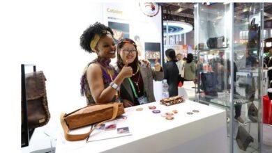 People pose for photos at the booth of South Africa at the 6th China International Import Expo (CIIE) in east China's Shanghai, Nov. 6, 2023. (Xinhua/Fang Zhe)