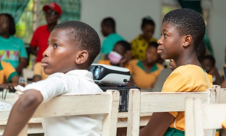 • The students listening to a presentation at the event