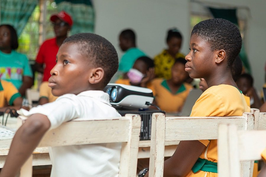 • The students listening to a presentation at the event