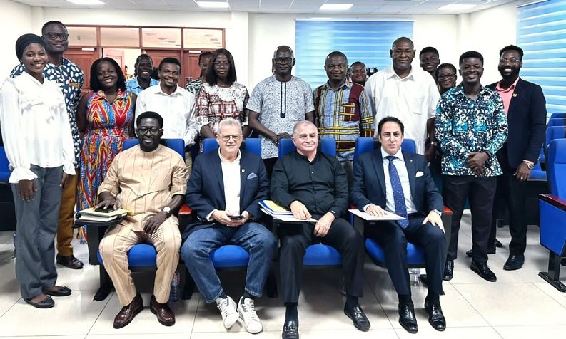 • Ambassador Maher Kheir (seated right) with other dignitaries and the students