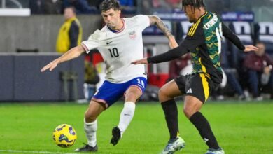 • United States forward Christian Pulisic (10) controls the ball away from Jamaica midfielder Joel Latibeaudiere