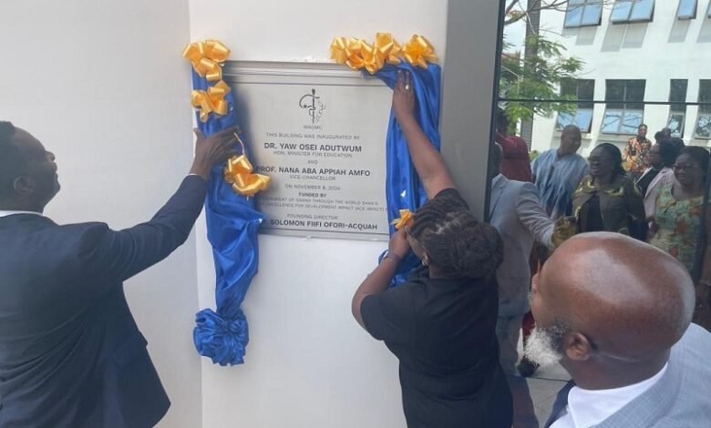 • Dr Adutwum (left) and Prof. Amfo (right) unveiling an inscription on the building complex