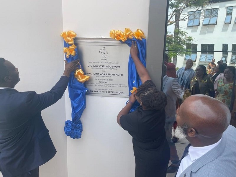 • Dr Adutwum (left) and Prof. Amfo (right) unveiling an inscription on the building complex