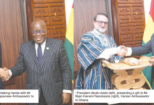 • President Akufo-Addo (left) shaking hands with Mr Hisanobu Mochikuki (right), Japanese Ambassador to Ghana • President Akufo-Addo (left), presenting a gift to Mr Bijan Gerami Nazoksara (right), Iranian Ambassador to Ghana