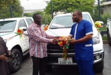 • (Inset) Mr Bafour Awuah (left) presenting the keys to the vehicles to Mr Brimah