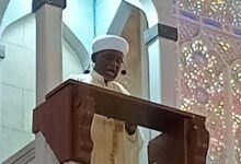 • Imam Alhassan (inset) delivering the sermon