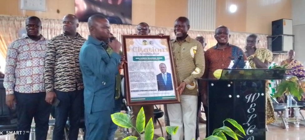• Mr Joseph Boahen Aidoo (right) receiving his award from the leadership of the farmers group for his contributions to the sector