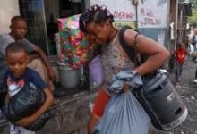 • People carry belongings as they flee Port-au-Prince's neighbourhood of Nazon due to gang violence