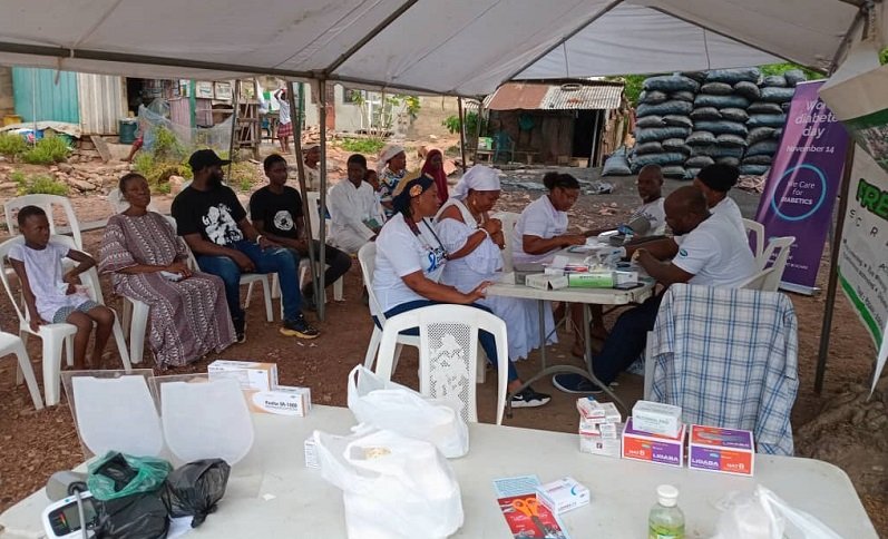 • Members of the foundation screening the Weija community