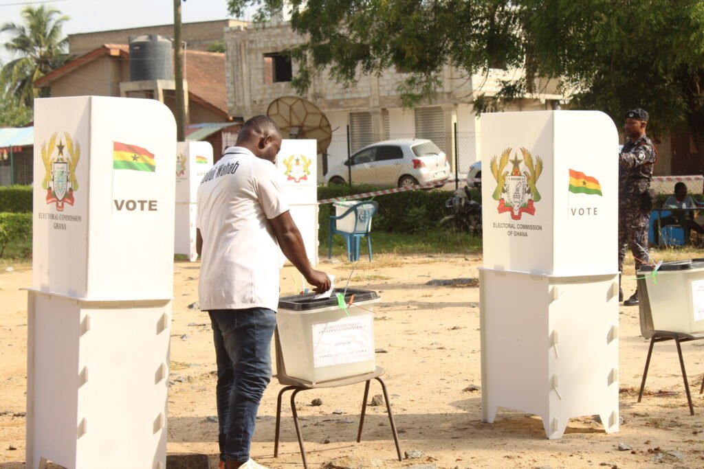 • A voter casting his vote