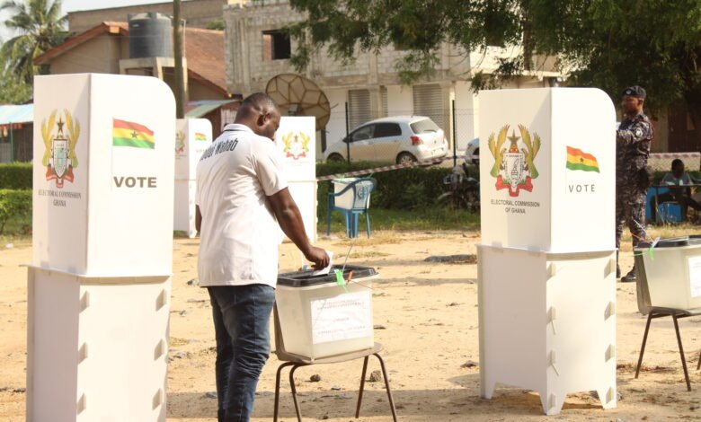 • A voter casting his vote