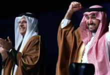 • Asian Football Confederation President Sheikh Salman bin Ibrahim al-Khalifa and Saudi Arabia's Minister of Sports and Youth, Abdulaziz bin Turki Al Faisal, celebrate the announcement