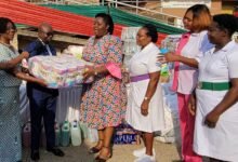 • Reverend Osei (second from left) presenting some of the items to Dr Akosua Agyeibea Ayeh