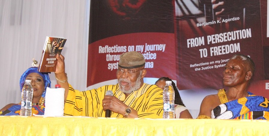 • Dr Nyaho Nyaho-Tamakloe (middle) launching the book Photo: Ebo Gorman