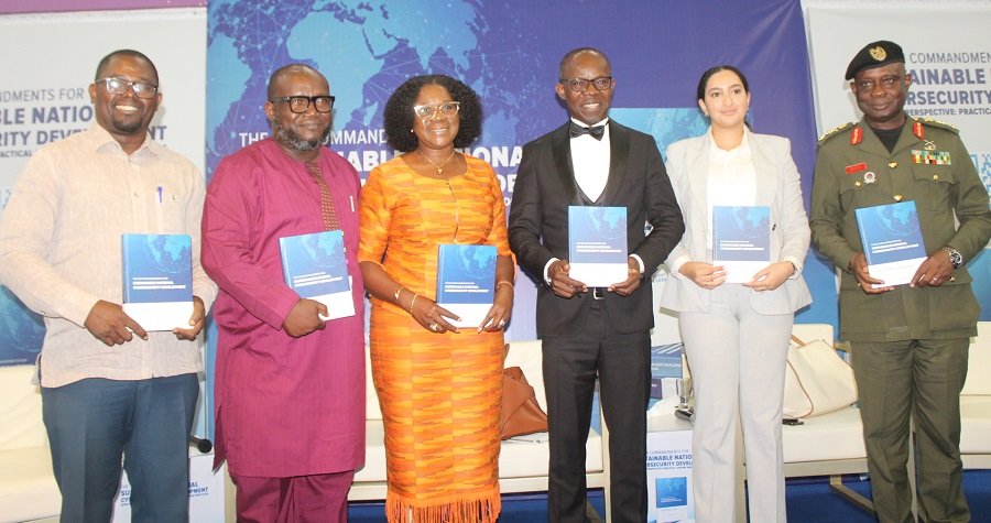 • Dr Antwi-Boasiako (third from right), Maj. Gen. Emmanuel W. Kotia (right), Dr Ken Ashigbey (second from left) and other guests launching the book Photo: Ebo Gorman