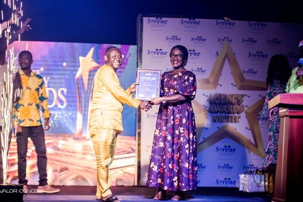 Mr Senya, the national overall best agent for 2024, receiving a citation from Mrs Boampong