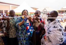 • Mrs Rebecca Akufo-Addo (middle) cutting tape to officially hand over the school block