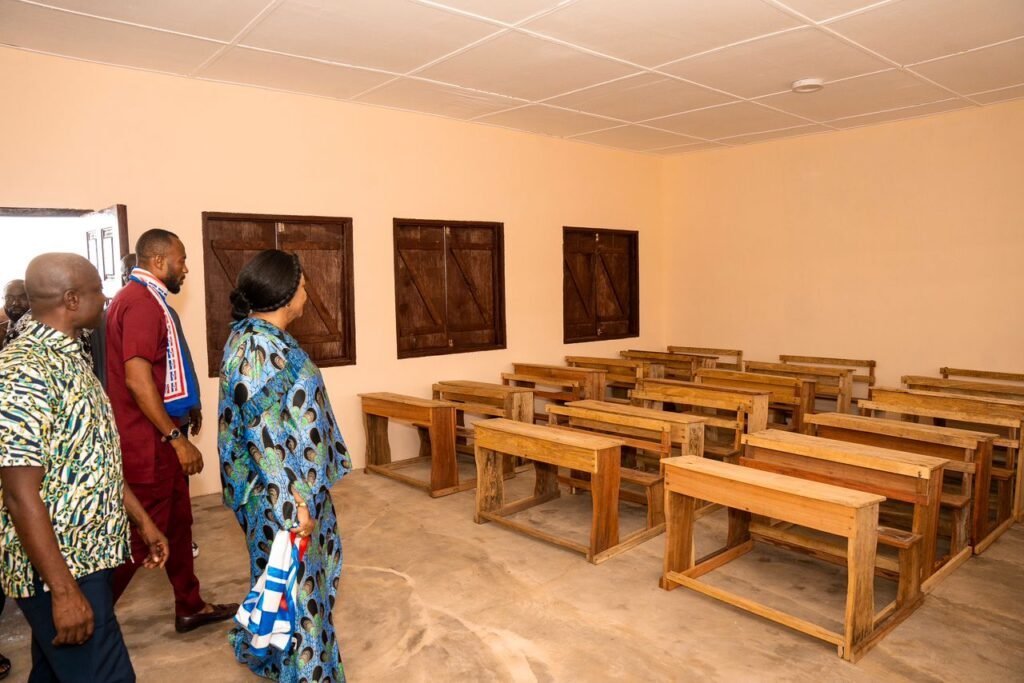 Mrs Rebecca Akufo-Addo(right) being led to inspect the classrooms 