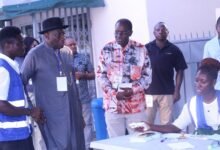 Mr Goodluck Jonathan (second from left)with other observers at a tour of a polling station