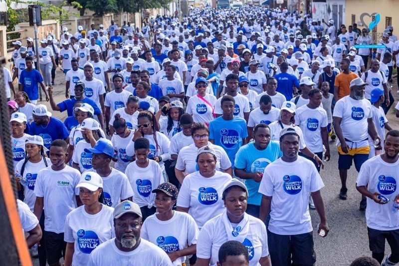 • Residents of the community walking to promote peace and good health
