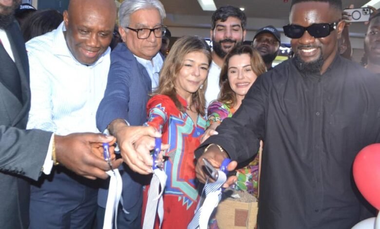 Mr Ramesh Sadhwani (second from left) with Mr Olympia (left) and other dignitaries after cutting the tape to open the Melcom shop at Accra Mall Photo:Victor A. Buxton