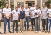 • Mr Fakhry (middle) flanked by tennis officials and players with their trophies