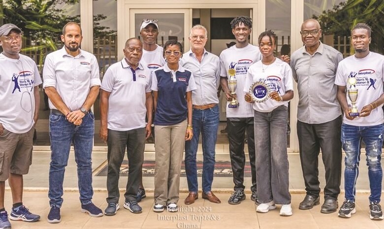 • Mr Fakhry (middle) flanked by tennis officials and players with their trophies