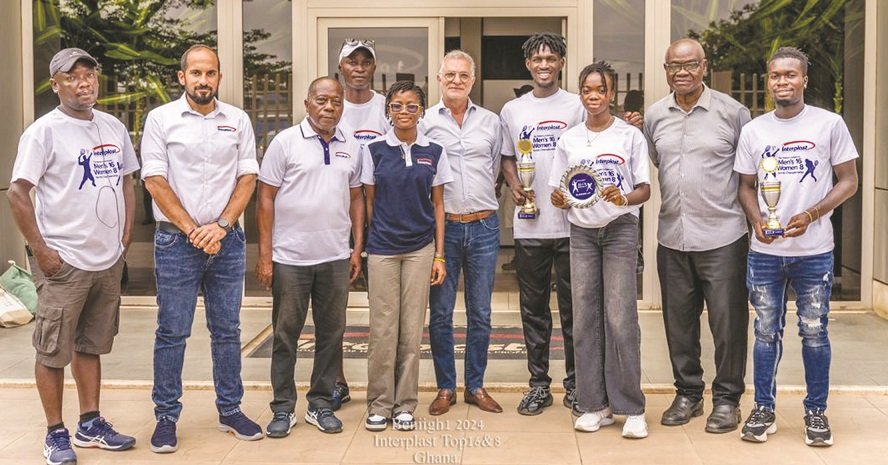 • Mr Fakhry (middle) flanked by tennis officials and players with their trophies