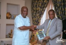 President-elect, John DramaniMahama receiving a bible from Rev. Stephen YenusomWengam