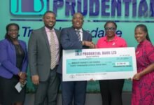 • Mr Quayson (third from left) handing over the cheque to Gina Kumah Dzagah, Executive Secretary, BSoG (first from right)