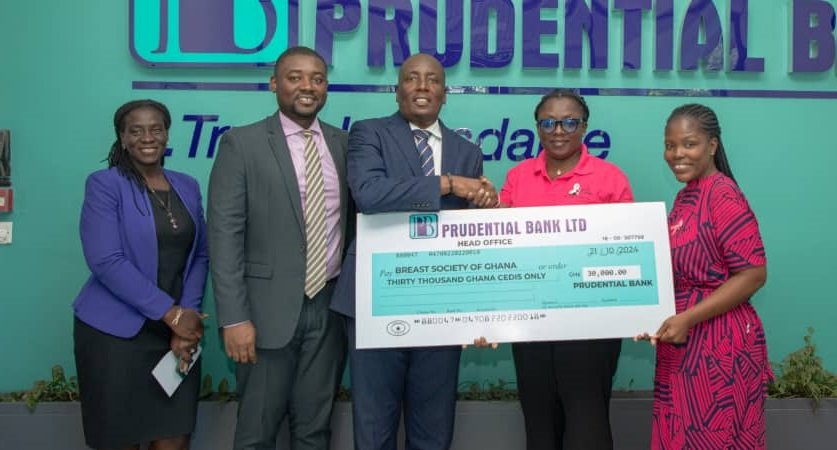 • Mr Quayson (third from left) handing over the cheque to Gina Kumah Dzagah, Executive Secretary, BSoG (first from right)