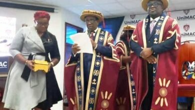 • Prof. Eric Opoku Mensah (right) and Emeritus Prof. Kwesi Yankah (middle) during the investiture ceremony