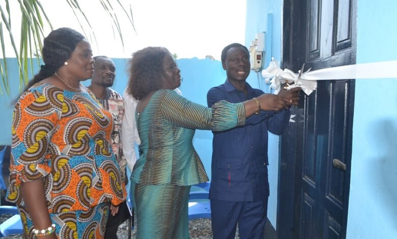 • Mr Nkrumah (right) being asssited by Ms Kotomah (middle) to cut the tape to hand over the WASH facility to Presec SHS . With them include Ms Tetteh Photo Victor A. Buxton