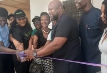 • Dr obeng (third from right) and others cutting the ribbon to open the facility